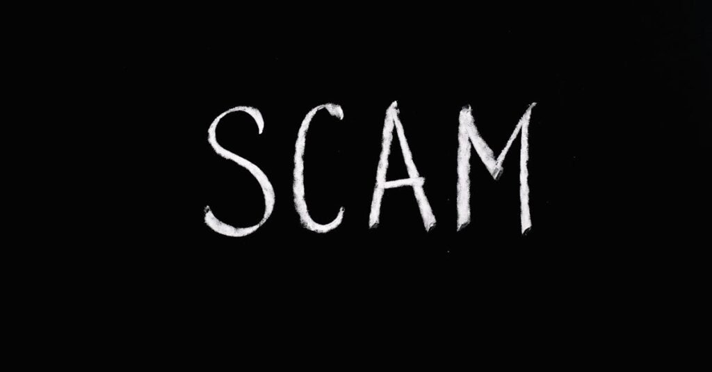 pexels-photo-5697260-5697260-1 Chalk-drawn text 'SCAM' on black background, representing fraud and deception.